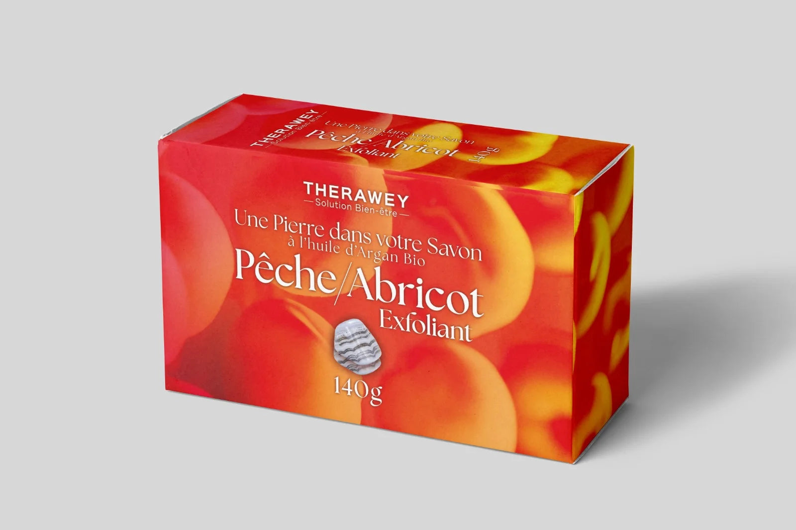 Savon exfoliant pêche abricot à l’huile d’argan bio avec pierre naturelle intégrée, 140 g, soin fruité et revitalisant pour une peau douce et éclatante.
